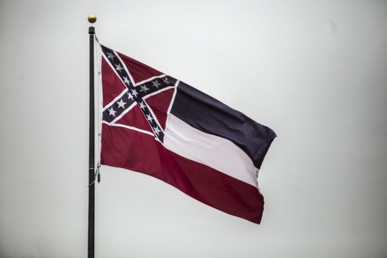 Mississippi furls state flag with Confederate emblem after 126 years