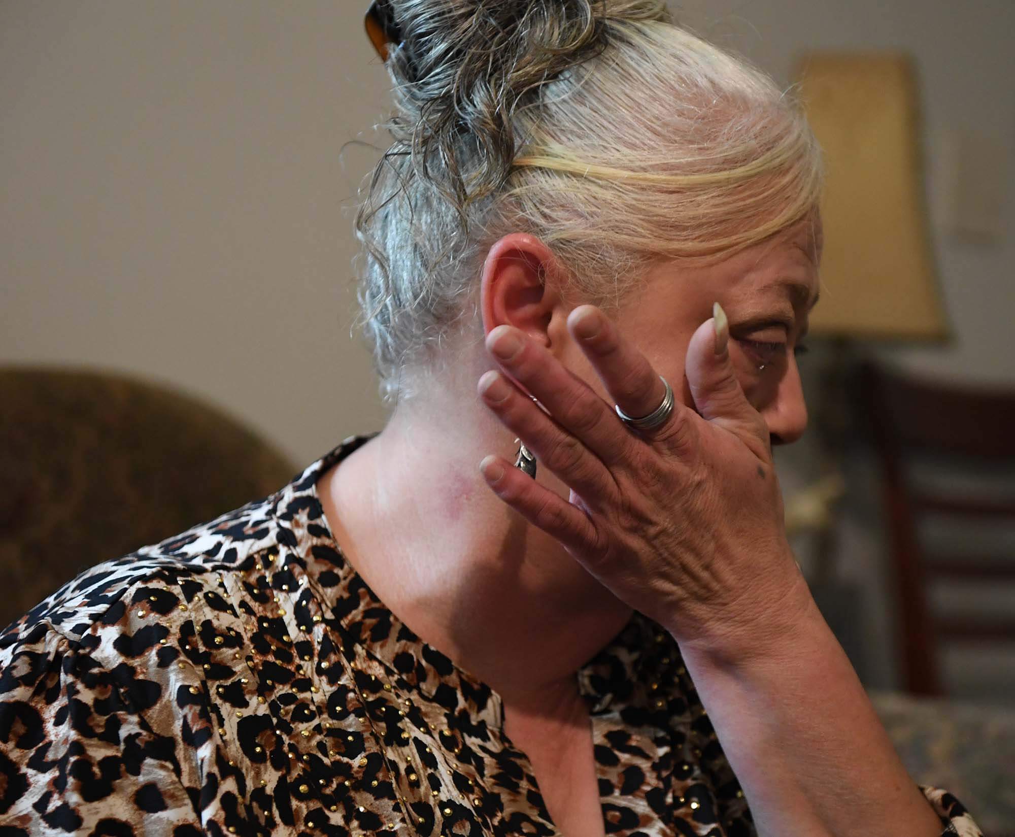 Cheryl Baier of Forest, is overcome with emotion recounting the night she was beaten by her then boyfriend, Tuesday, Aug. 5, 2025.