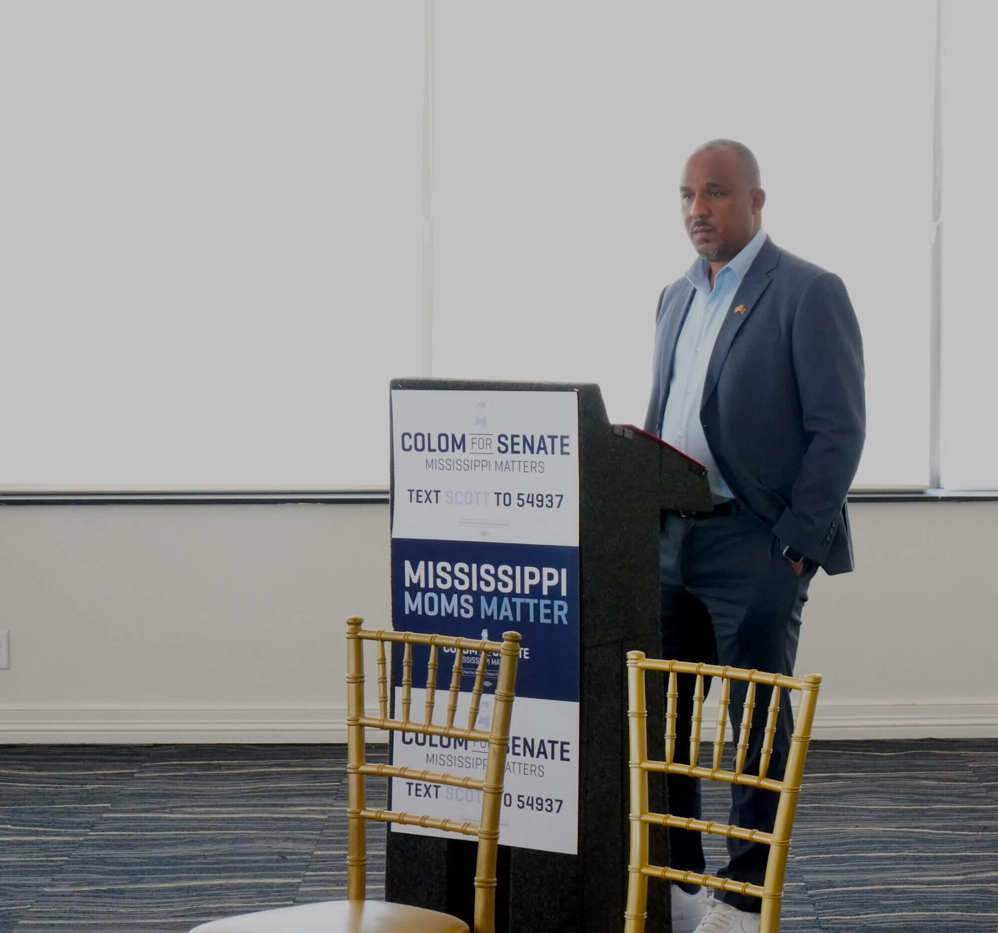 Scott Colom, Democratic nominee for the U.S. Senate, listens to panelists discuss Mississippi's maternal healthcare metrics in downtown Jackson on Aug. 1, 2026.