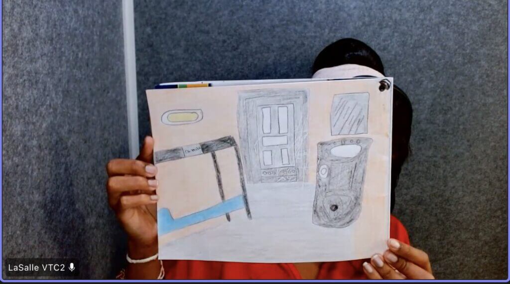 Camila Toro de Paula shows a drawing of the cell where she’s kept in administrative segregation at the Central Louisiana ICE Processing Center in Jena, Louisiana. Credit: Courtesy photo