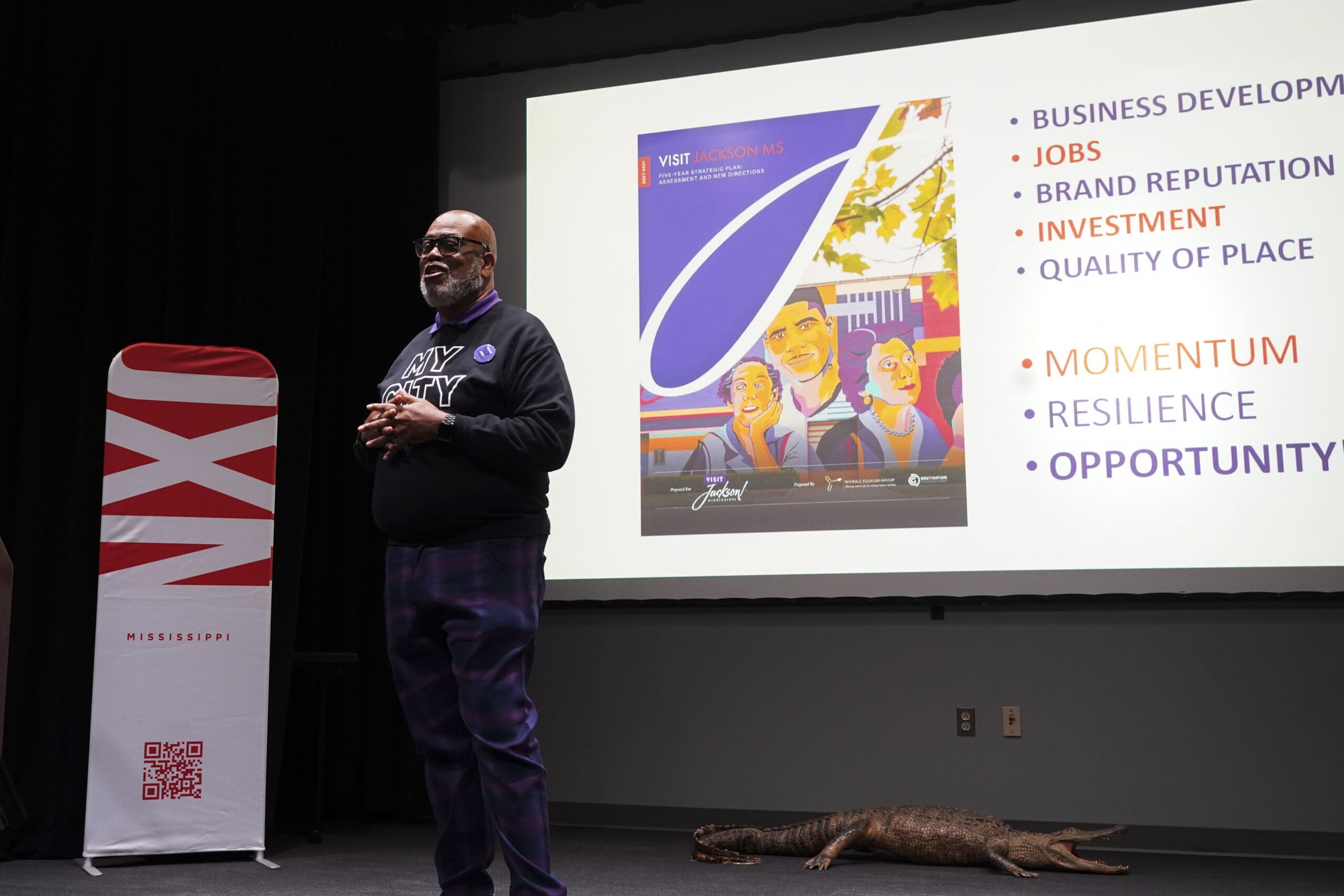 Visit Jackson CEO Ricky Thigpen gives a presentation during the agency's State of Tourism Address at the Mississippi Museum of Natural Science on Tuesday, Oct. 13, 2026.